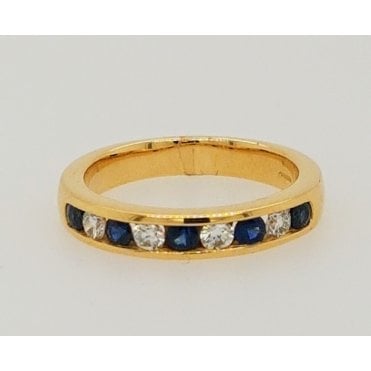 18ct yellow gold channel set 9 Stone Sapphire and Diamond Ring